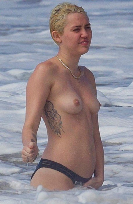 Miley Cyrus Bares Topless Breasts On Beach